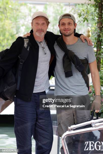 Mads Mikkelsen and Carl Jacobsen Mikkelsen arrive at the Hotel Excelsior pier for the 80th Venice International Film Festival 2023 on August 31, 2023...