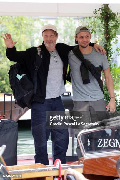 Mads Mikkelsen and Carl Jacobsen Mikkelsen arrive at the Hotel Excelsior pier for the 80th Venice International Film Festival 2023 on August 31, 2023...