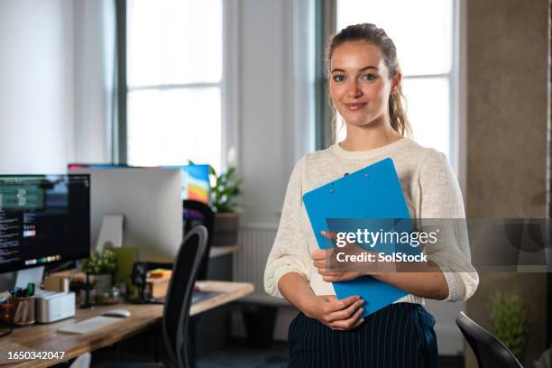 confident young office worker - employee dedication stock pictures, royalty-free photos & images
