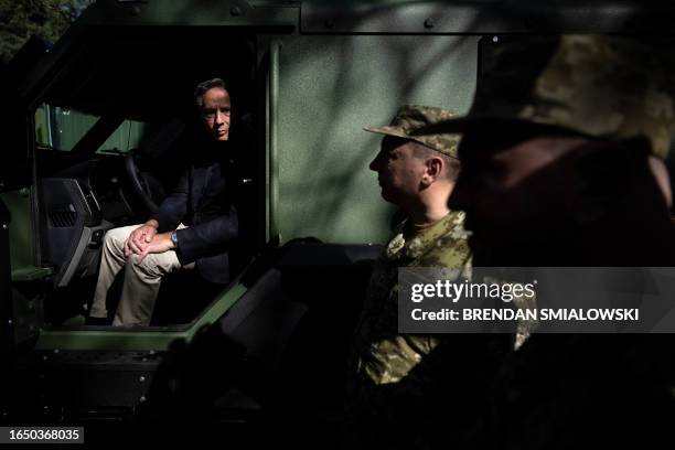 Secretary of State Antony Blinken sits in a MRAP donated by the United States while touring a State Border Guard of Ukraine Detached Commandant...