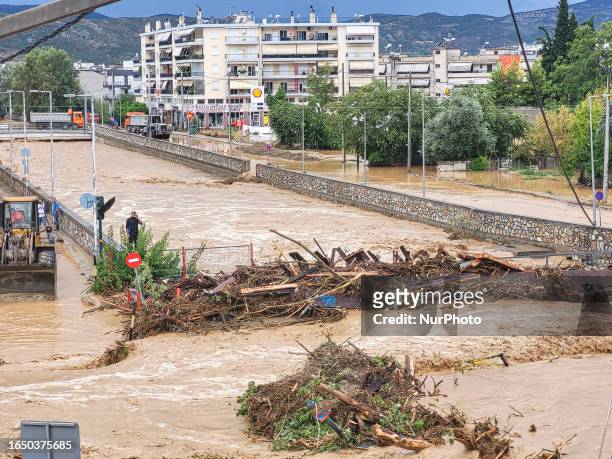 The aftermath of the fierce rainstorms hit central Greece showing the damage from the floods while roads are still covered by floodwater and mud and...