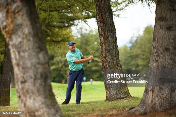 Padraig Harrington of Ireland plays his 2nd shot on the 2nd hole during Day One of the Omega European Masters at Crans-sur-Sierre Golf Club on August...