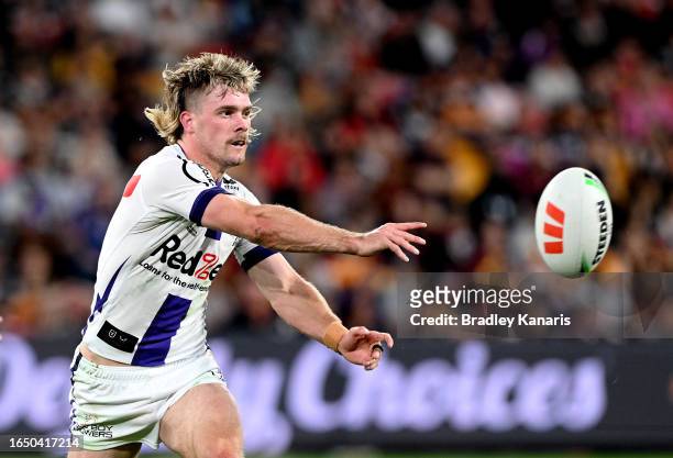 Ryan Papenhuyzen of the Storm passes the ball during the round 27 NRL match between the Brisbane Broncos and Melbourne Storm at Suncorp Stadium on...