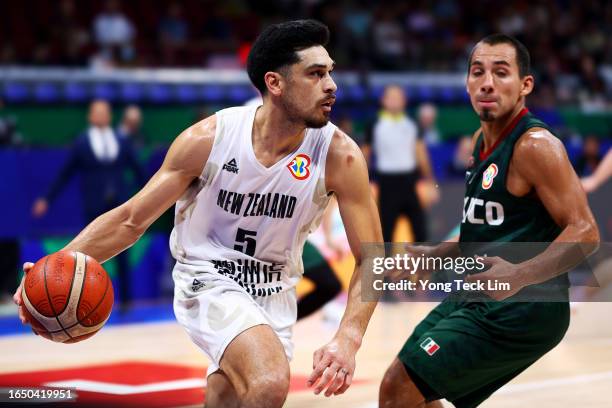 Shea Ili of New Zealand drives against Paul Stoll of Mexico in the fourth quarter during the FIBA Basketball World Cup Classification 17-32 Group N...