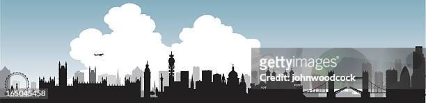 silhouette of london skyline with single large cloud graphic - london skyline stock illustrations