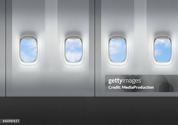 airplane windows - patrijspoort stockfoto's en -beelden