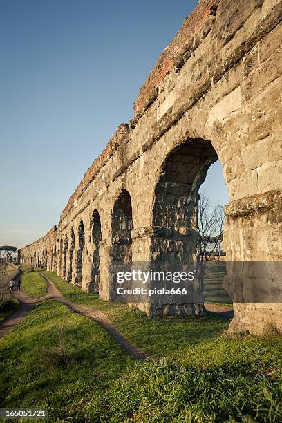 the roman aqueduct at parco degli acquedotti - roman plumbing stock pictures, royalty-free photos & images