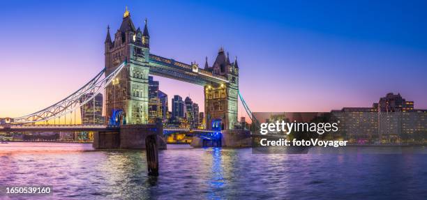 london tower bridge city skyscrapers river thames illuminated sunset panorama - london stock pictures, royalty-free photos & images