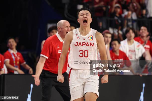 Keisei Tominaga of Japan celebrates a three point basket during the FIBA Basketball World Cup Classification 17-32 Group O game between Japan and...