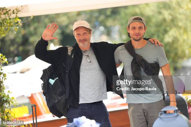 Mads Mikkelsen and Carl Jacobsen Mikkelsen are seen arriving at the 80th Venice International Film Festival 2023 on August 31, 2023 in Venice, Italy.