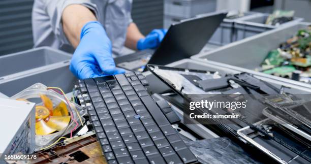 repairman repairing laptop keyboard - recycling stock pictures, royalty-free photos & images