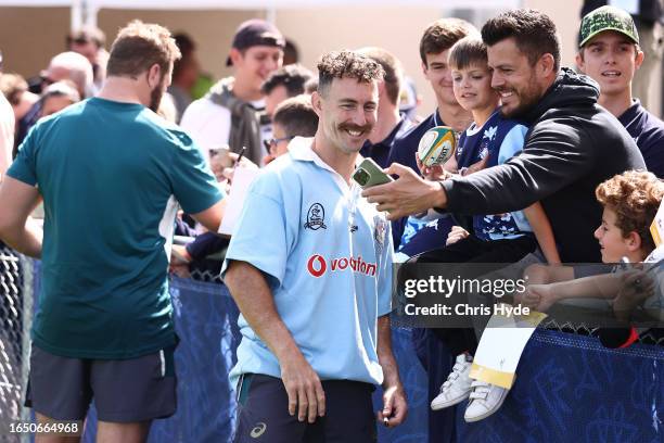 Nic White poses with fans during an Australia Wallabies training session ahead of the Rugby World Cup France 2023, at Stade Roger Baudras on August...