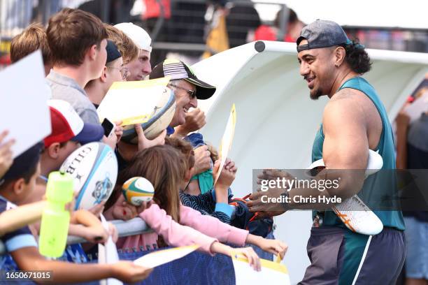 Pone Fa'amausili with fans during an Australia Wallabies training session ahead of the Rugby World Cup France 2023, at Stade Roger Baudras on August...