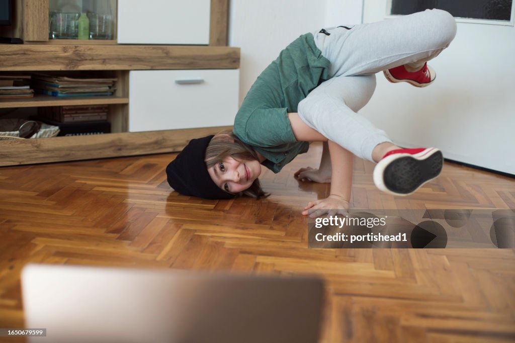 Smiling boy making dance videos to share on social media
