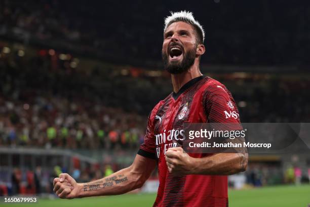 Olivier Giroud of AC Milan celebrates after scoring his second penalty to give the side a 4-1 lead during the Serie A TIM match between AC Milan and...