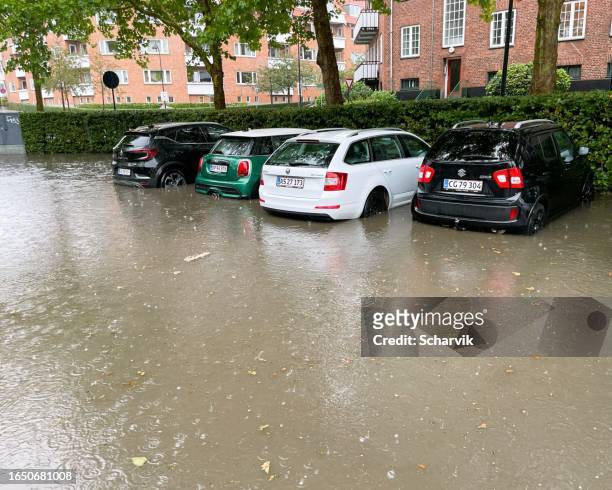 flooded parking lot in holte, denmark - heavy rain stockfoto's en -beelden