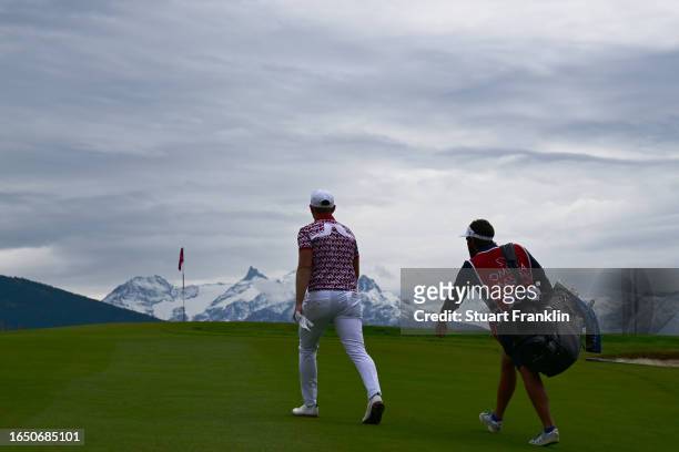 Matt Wallace of England and his caddie walk on the 7th hole during Day One of the Omega European Masters at Crans-sur-Sierre Golf Club on August 31,...
