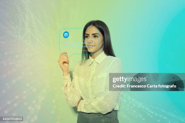 woman using new chatbot technology - smartphone hologram stock-fotos und bilder