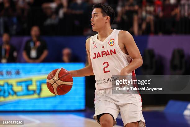 Yuki Togashi of Japan dribbles the ball during the FIBA Basketball World Cup Classification 17-32 Group O game between Japan and Venezuela at Okinawa...
