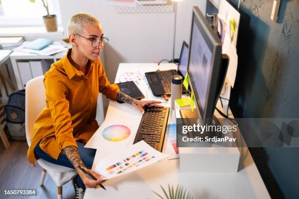 young woman working at her home office - design professional stock pictures, royalty-free photos & images