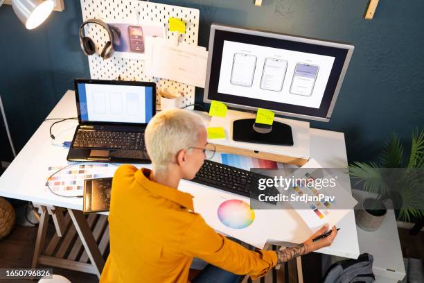 young woman working at her home office - graphic designer stock pictures, royalty-free photos & images