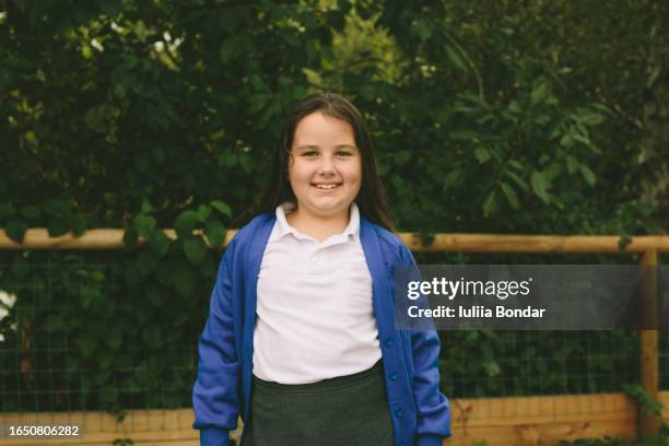 portrait of elementary school girl smiling - chubby girls photos bildbanksfoton och bilder