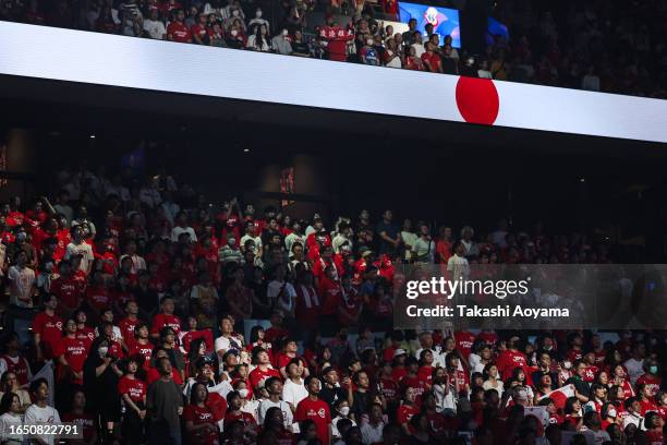 Team Japan fans sing the national anthem prior to the FIBA Basketball World Cup Classification 17-32 Group O game between Japan and Venezuela at...