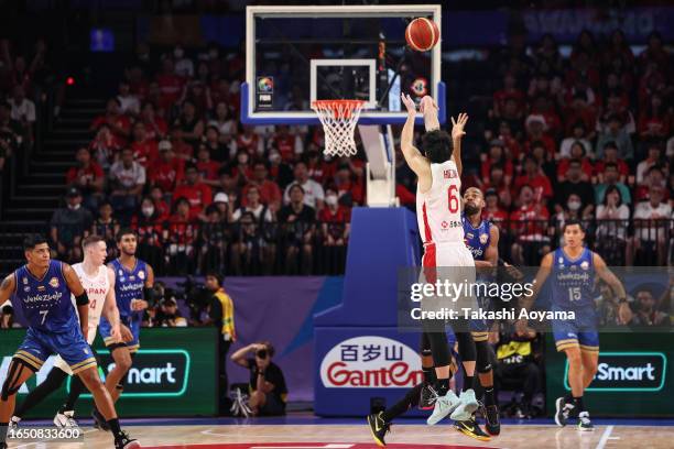 Makoto Hiejima of Japan shoots a three point shot during the FIBA Basketball World Cup Classification 17-32 Group O game between Japan and Venezuela...