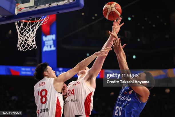 Yohanner Sifontes of Venezuela shoots under pressure from Yudai Baba and Joshua Hawkinson of Japan during the FIBA Basketball World Cup...