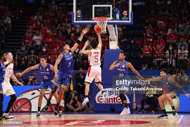 Yuki Kawamura of Japan shoots under pressure from Venezuela defense during the FIBA Basketball World Cup Classification 17-32 Group O game between...