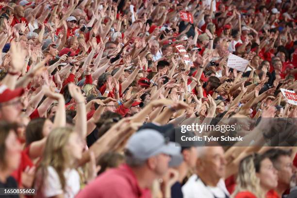 Fans chant 'Roof, roof, roof' after a block by the Nebraska Cornhuskers against the Omaha Mavericks during Nebraska Volleyball Day at Memorial...