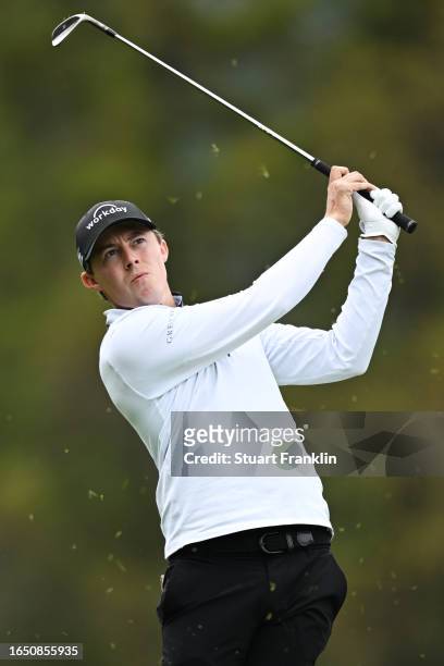 Matt Fitzpatrick of England plays their second shot on the 12th hole during Day One of the Omega European Masters at Crans-sur-Sierre Golf Club on...