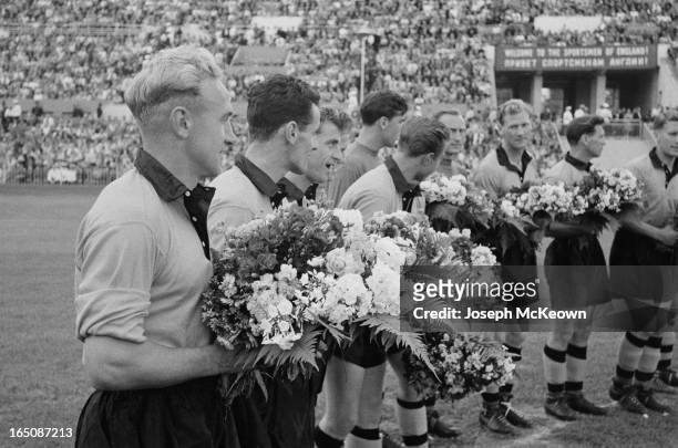 The Wolverhampton Wanderers football team being presented with flowers before playing Spartak Moscow in Moscow, 7th August 1955. Wolves captain Billy...