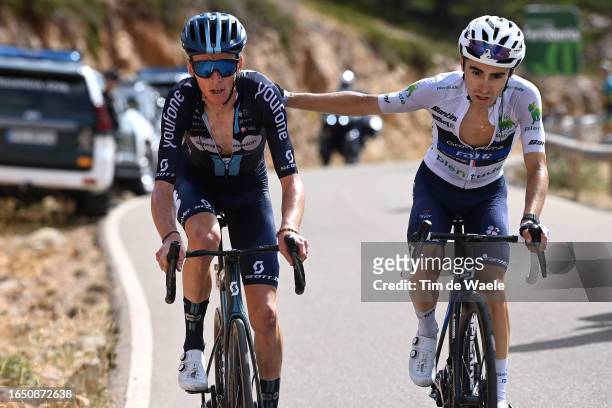 Romain Bardet of France and Team DSM - Firmenich and Lenny Martinez of France and Team Groupama - FDJ - White Best Young Rider Jersey compete in the...