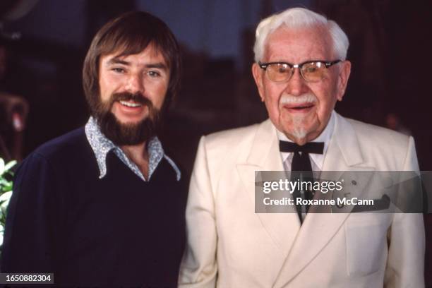 American cinematographer John Toll poses with Colonel Harland David Sanders who founded the fast food restaurant chain Kentucky Fried Chicken and who...