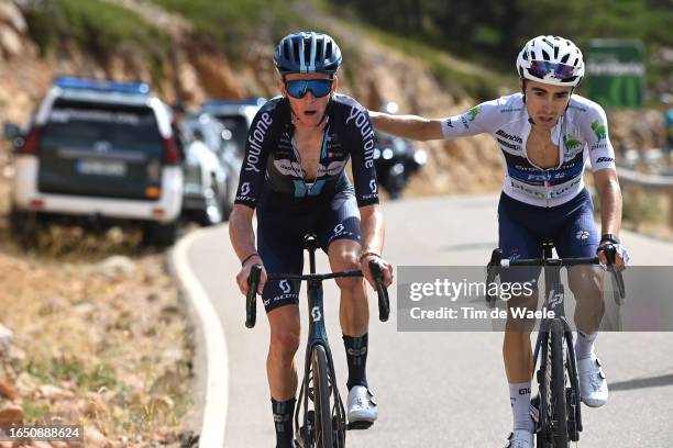 Romain Bardet of France and Team DSM - Firmenich and Lenny Martinez of France and Team Groupama - FDJ - White Best Young Rider Jersey compete in the...