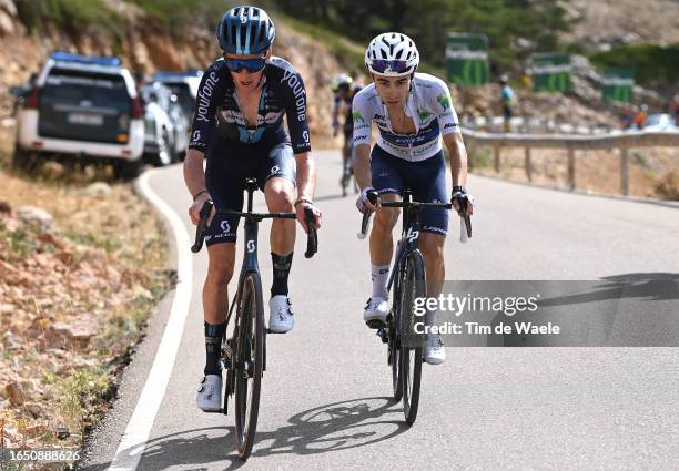 Romain Bardet of France and Team DSM - Firmenich and Lenny Martinez of France and Team Groupama - FDJ - White Best Young Rider Jersey compete in the...