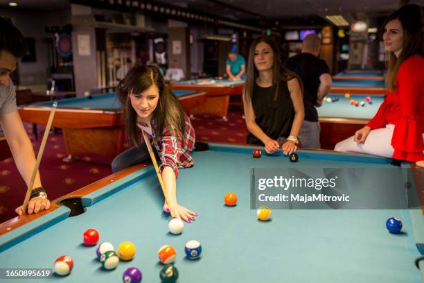 group of friends play billiards - snooker stock pictures, royalty-free photos & images