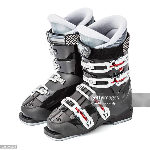ski boots, isolated on white background - skischoen stockfoto's en -beelden