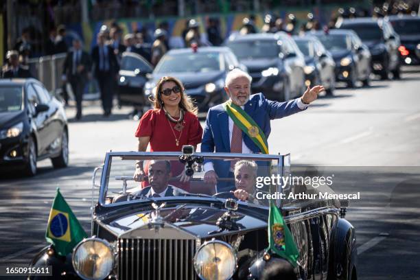 President of Brazil Luiz Inácio Lula da Silva and the First Lady of Brazil Rosangela Janja da Silva wave supporters during a commemorative parade to...