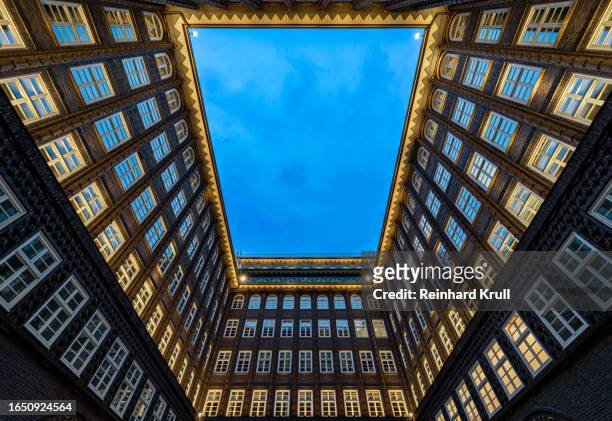 low angle view of hamburg chilehaus at night - hamburg germany stock pictures, royalty-free photos & images