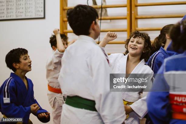 judo martial arts training celebration - child judo stock pictures, royalty-free photos & images