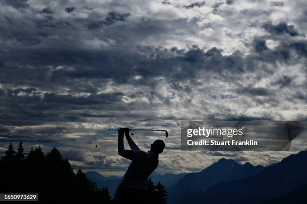 Matt Fitzpatrick of England plays their second shot on the 14th hole during Day One of the Omega European Masters at Crans-sur-Sierre Golf Club on...