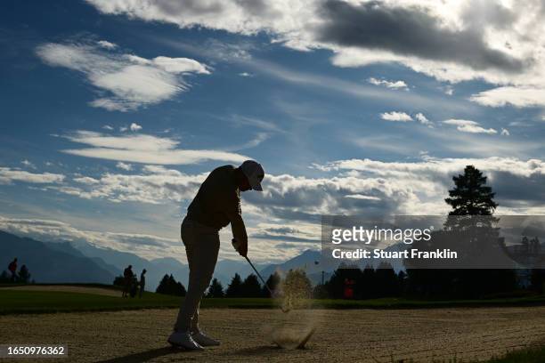 Rasmus Hojgaard of Denmark plays a bunker shot on the 17th hole during Day One of the Omega European Masters at Crans-sur-Sierre Golf Club on August...