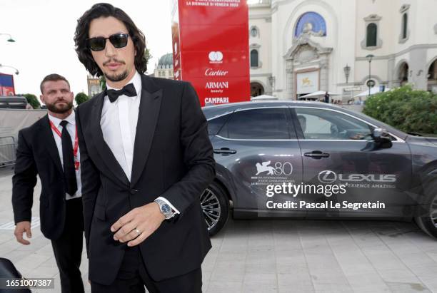 Adam Driver arrives on the red carpet ahead of the "Ferrari" screening during the 80th Venice International Film Festival at Palazzo del Casino on...