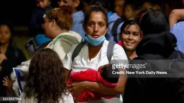 September 6: Members of the Cumales/Suarez family from Venezuela along along with dozens of other migrants/immigrants families are seen arriving from...
