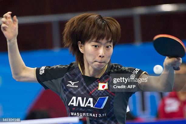 Kasumi Ishikawa of Japan returns a shot during her match against Yu Mengyu of Singapore at the World Team Classic Table Tennis game in Guangzhou,...