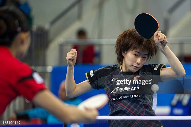 Kasumi Ishikawa of Japan returns a shot during her match against Yu Mengyu of Singapore at the World Team Classic Table Tennis game in Guangzhou,...