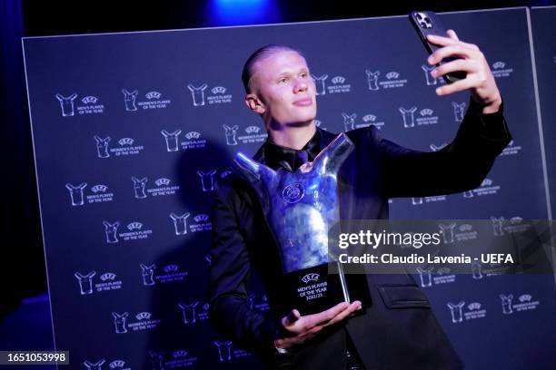 Erling Haaland of Manchester City poses with the UEFA Men’s Player of the Year award during the UEFA Champions League 2023/24 Group Stage Draw at...