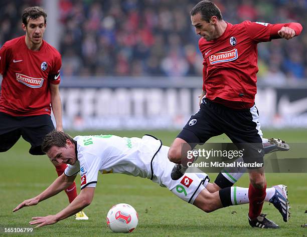 Pavel Krmas of Freiburg challenges Luuk De Jong during the Bundesliga match between SC Freiburg and VfL Borussia Moenchengladbach at MAGE SOLAR...